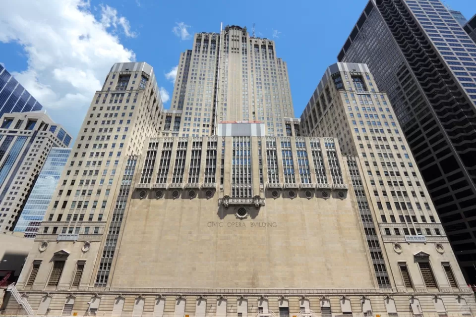 The exterior of the Civic Opera Building in Chicago, an art deco building built in the 1920s.
